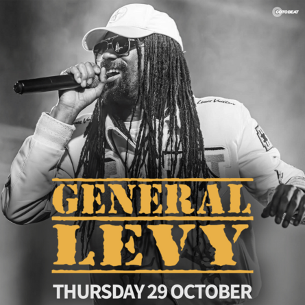 General Levy performing on stage holding a microphone. Text overlay reads 