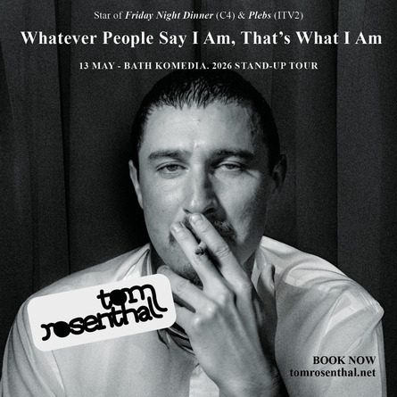 A black and white photo of the comedian Tom Rosenthal smoking a Cigarette
