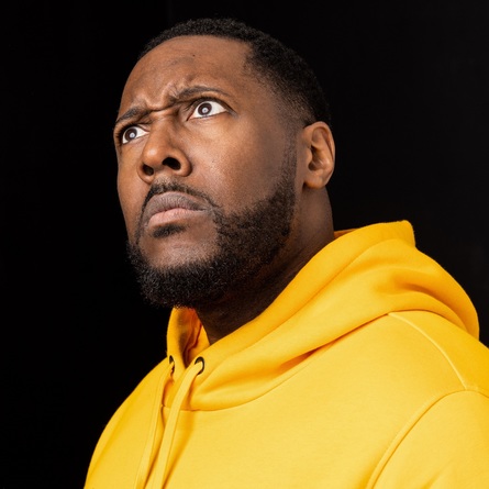 Aurie Styla in a yellow hoodie